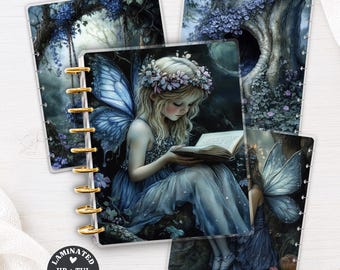 May include: A set of laminated planner covers featuring a fairy with blue wings and a flower crown reading a book in a forest. The covers have gold-colored binding discs and include a circular black label with the text LAMINATED HP + TUL PLANNER COVER.