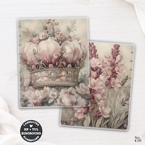 May include: Two rectangular laminated planner dashboards with punched edges. One features a detailed illustration of a crown adorned with pink flowers and pearls. The other displays a vertical arrangement of pink floral stalks and greenery.