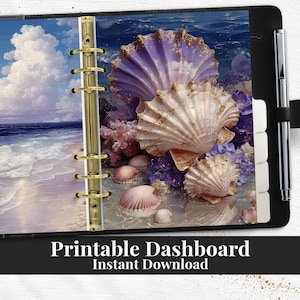 May include: A black planner with a beach scene and seashell design. The planner features a gold binder and a pen holder. The beach scene includes a blue sky, ocean waves, and seashells in shades of pink, purple, and white. Text at the bottom reads "Printable Dashboard Instant Download."