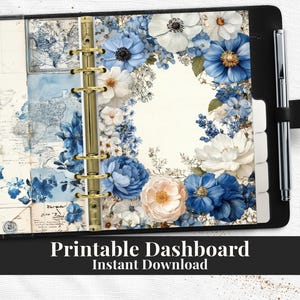 May include: A black planner with a gold binder ring and pen loop. The planner's interior features a floral design with blue and white flowers. The text "Printable Dashboard Instant Download" is at the bottom of the image.