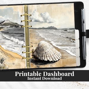 May include: A black planner with a beach scene print, featuring a seashell on the shore. The planner has gold rings, a pen holder, and the text "Printable Dashboard Instant Download".