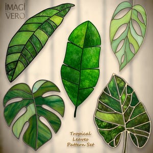 May include: Six stained glass tropical leaves in shades of green. Each leaf has a unique design and a dark border. The text "Tropical Leaves Pattern Set" is visible. The leaves are decorative.