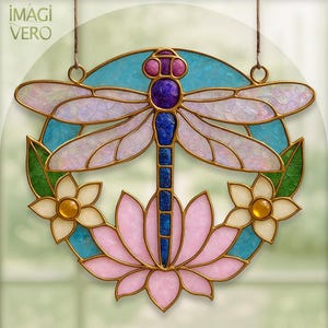 May include: Stained glass dragonfly with a pink lotus flower and two white flowers with yellow centers. The dragonfly has iridescent wings, a purple head, and a blue body. The design is framed by a gold border and the text "IMAGI VERO".