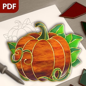 May include: A stained glass pumpkin design with orange, green, and gold accents. The pumpkin is on a white surface with a PDF icon in the upper left corner. The design includes a stem, leaves, and decorative swirls.