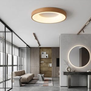 Puede incluir: Un juego de tres tazas de cerámica con un acabado mate moteado. Las tazas son de color crema, gris claro y gris oscuro. Cada taza tiene un diseño simple y minimalista y un asa redondeada.