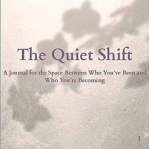 May include: A book cover with a light grey background and a shadow of leaves. The title "The Quiet Shift" is in purple text. The subtitle is "A Journal for the Space Between Who You've Been and Who You're Becoming". The text "Created by The Barefoot Oracle - Corrie" is at the bottom of the cover.