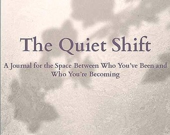 May include: A book cover with a light gray background and a shadow of leaves. The title "The Quiet Shift" is in purple text. The subtitle is "A Journal for the Space Between Who You've Been and Who You're Becoming". The text "Created by The Barefoot Oracle - Corrie" is at the bottom of the cover.
