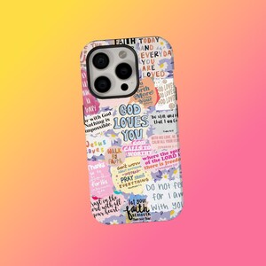 May include: A phone case with a colourful collage design. The case features the text "GOD LOVES YOU" in large letters, surrounded by other inspirational phrases and floral accents. The case is designed to fit a smartphone.
