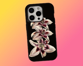 May include: Black phone case featuring a floral design of white and burgundy lilies. The lilies are arranged vertically on the case. The phone case has a black border and a camera cutout.