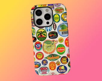 May include: A phone case covered in colorful vintage fruit and produce stickers. The stickers feature various fruits, brands, and text, including "Del Monte," "Maui," and "Pero." The case has a white background and a glossy finish.