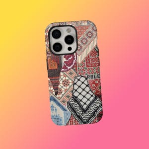 May include: A patterned phone case with a colourful design. The case features a patchwork of geometric patterns in red, white, black, and blue. The word "PALESTINE" is visible on the case.
