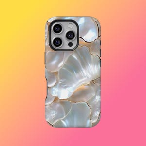 May include: A phone case with a mother-of-pearl effect, featuring a layered, shell-like pattern. The case has a black camera module with three lenses and a flash. The iridescent white and gold tones create a luxurious appearance.