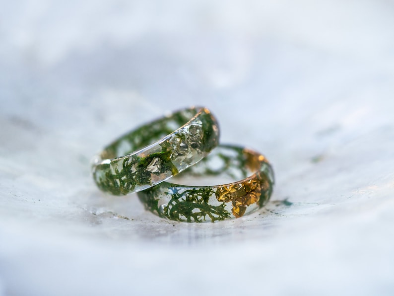 Forest inspired resin band showing real moss and shimmering flakes inside, comfortable polished ring in many sizes.