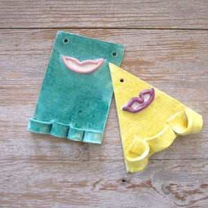 Fun hand made ceramic toothbrush holders, whimsical shapes, smiling lips, kids bathroom decor