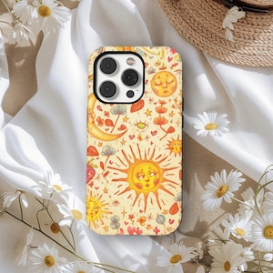 May include: A phone case with a whimsical design featuring a smiling sun, moon, stars, and floral elements in shades of yellow, orange, and red. The case has a protective bumper and a glossy finish.