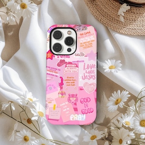 May include: Pink phone case with a collage design featuring religious quotes and phrases. The case includes text such as "Love Like Jesus," "God is Good," and "Pray." The design incorporates pink hearts, stars, and a tiger illustration.