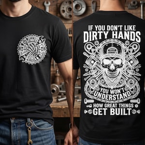 May include: A black t-shirt featuring a white graphic on the front chest of a gear with crossed wrenches. The back displays a large white graphic of a skull wearing a cap and bandana, surrounded by tools and the text IF YOU DON'T LIKE DIRTY HANDS YOU WON'T UNDERSTAND HOW GREAT THINGS GET BUILT.