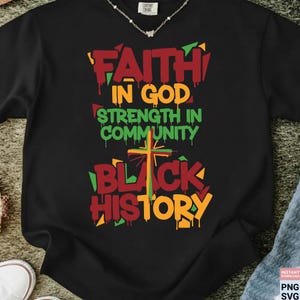 May include: Black t-shirt with the words "FAITH IN GOD STRENGTH IN COMMUNITY BLACK HISTORY" in red, orange, and green. The design includes a cross and dripping paint effect. The shirt is made of a soft material.