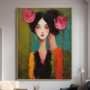 May include: An abstract painting of a woman with dark hair and pink floral accents. The woman is wearing a black top with yellow and orange sleeves. The background is green and teal. The artwork is framed in a gold frame.