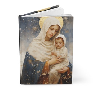 Puede incluir: Una pintura de estilo vintage de María sosteniendo al niño Jesús. La pintura está sobre un fondo azul y blanco con detalles dorados. La pintura está enmarcada en un marco negro.