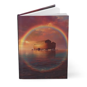 May include: A hardcover journal featuring an image of Noah's Ark on the water under a rainbow. The ark is a light brown color, and the sky is a mix of orange, red, and purple hues.