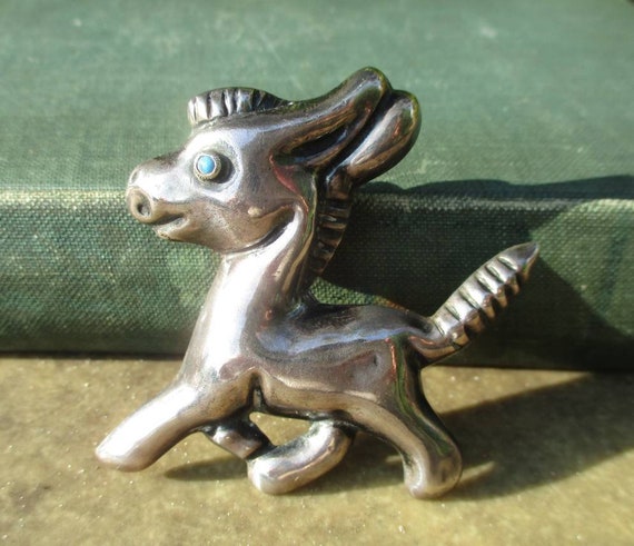 Donkey brooch deals