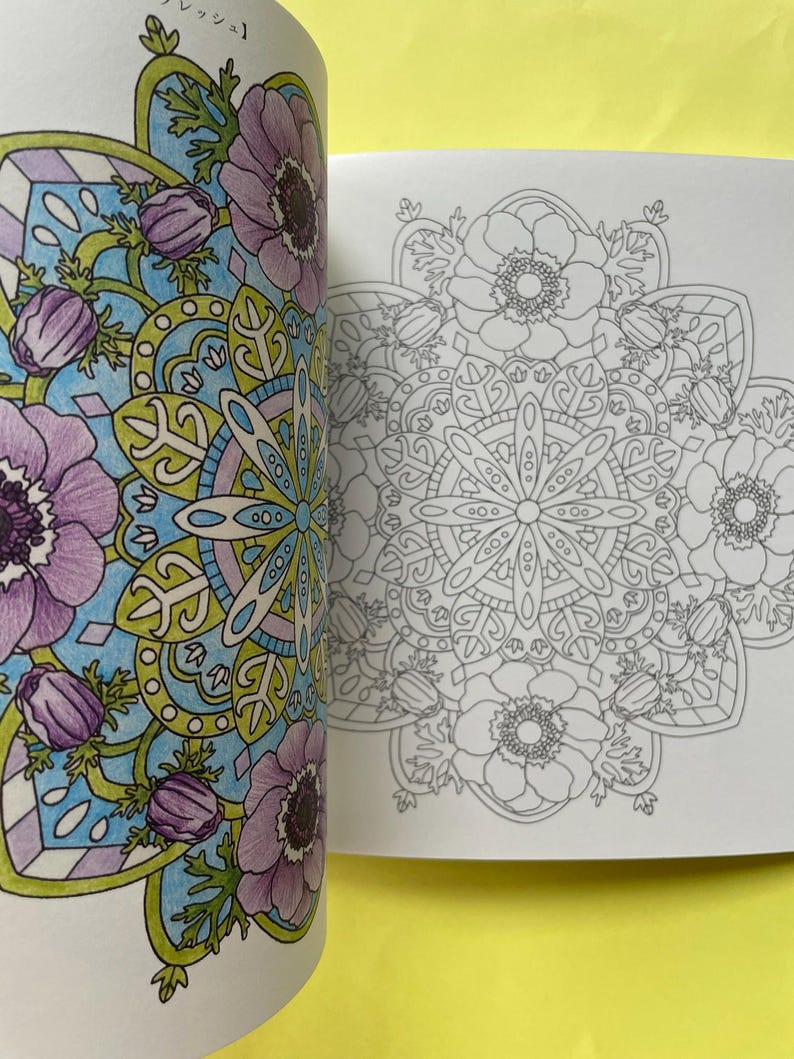 May include: A coloring book page featuring a circular floral mandala design. The left side shows a partially colored version with purple flowers, light blue backgrounds, and green leaves, while the right side displays the original black and white line art.