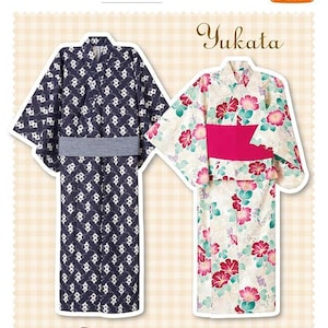 May include: A sewing pattern for two yukata garments, one in dark blue with a white geometric pattern and a grey obi, the other in cream with a pink and green floral print and a pink obi, accompanied by two pairs of wooden geta sandals.