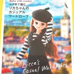 May include: A book cover featuring a doll wearing a black crochet beret and dress over a striped shirt. The text on the cover reads "Make with crochet" and "Licca's Casual Wardrobes."