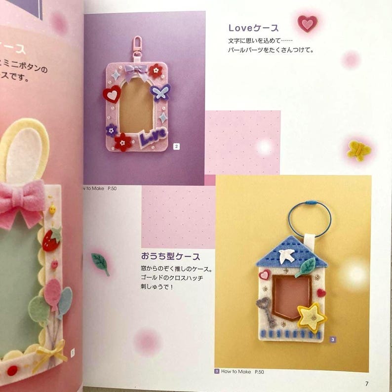 May include: A page from a craft book featuring felt projects. The image shows a pink rectangular frame with the word "Love" and decorative hearts, flowers, and butterflies. Another project is a house-shaped keychain with a star and key.