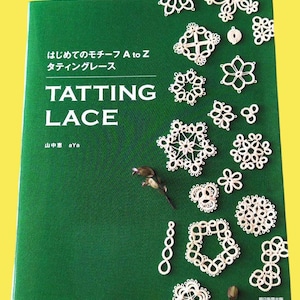 May include: A green book titled "Tatting Lace" with white text and examples of white lace designs. The book cover also features Japanese text and a small bird illustration. The book is on a yellow background.