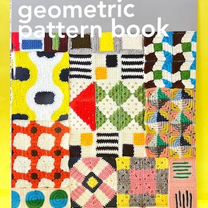 May include: A softcover book titled geometric pattern book with the subtitle applemints. The cover features a collage of colourful crocheted squares in various geometric designs including circles, triangles, and stripes in yellow, red, pink, and blue.