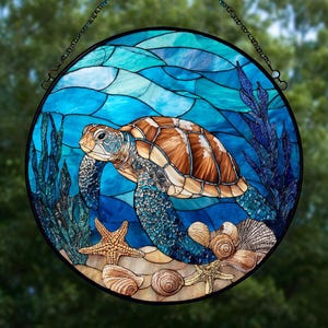 May include: Round stained glass window featuring a sea turtle swimming underwater. The turtle has a brown and tan shell, with blue and tan skin. The background is blue with wavy patterns, and the bottom has sand, starfish, and seashells.