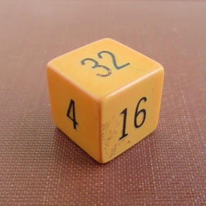 Bakelite Backgammon Doubling Cube - Vintage Yellow w/ Black & Red Number Coloring - About 5/8&quot;