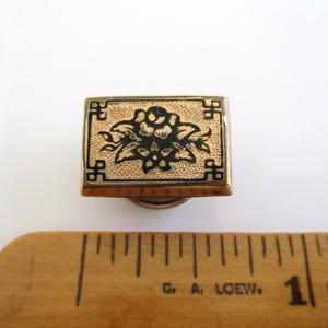 May include: A set of three ceramic mugs with a speckled, matte finish. The mugs are in shades of cream, light brown, and dark brown. Each mug has a simple, minimalist design, perfect for coffee or tea.