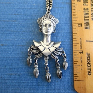 May include: A set of three ceramic mugs with a speckled, matte finish. The mugs are in shades of cream, light gray, and dark gray. Each mug has a simple, minimalist design and a rounded handle. Perfect for coffee or tea.