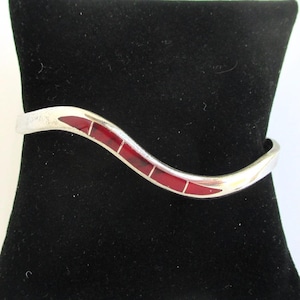 May include: A set of three ceramic mugs with a speckled, matte finish. The mugs are in shades of cream, light gray, and dark gray. Each mug has a simple, modern design and a rounded handle. The mugs are likely for coffee or tea.