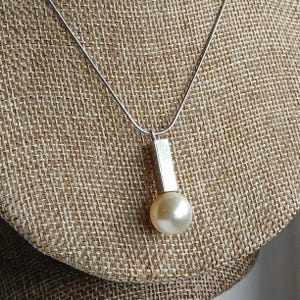 Pearl and stainless steel necklace. Minimalist, modernist, geometric, statement necklace.