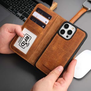 Funda tipo cartera para iPhone 15 Pro Max - Piel auténtica de plena flor - Bloqueo RFID y compatible con MagSafe - Soporte - Tarjetero - Color canela