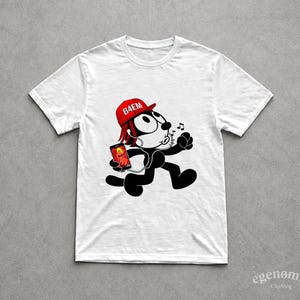 May include: White t-shirt featuring a cartoon cat with a red hat that says "B4EM". The cat is wearing headphones and holding a phone. The cat is running and musical notes are above its head. The shirt has the "egenomia clothing" logo.