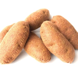 May include: A pile of six brown felt potatoes. The potatoes are arranged in a pyramid shape.