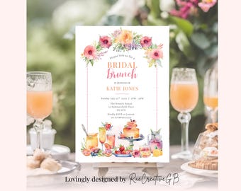 May include: A watercolor invitation for a bridal brunch, featuring floral accents and the text "Bridal Brunch." The invitation includes details like the date, time, and location. Two glasses of orange juice are in the foreground.