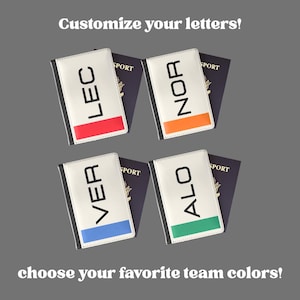 May include: White passport covers with black trim and colored stripes, featuring the letters LEC, NOR, VER, and ALO. The text "Customize your letters!" and "choose your favorite team colors!" are also visible.