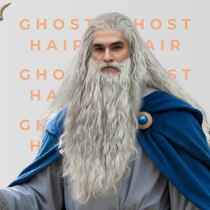May include: A long, wavy, silver-grey wig and matching beard set. The hair is styled with a centre part and flows down to the chest. The background features the repeating text GHOST HAIR in a light orange font colour.