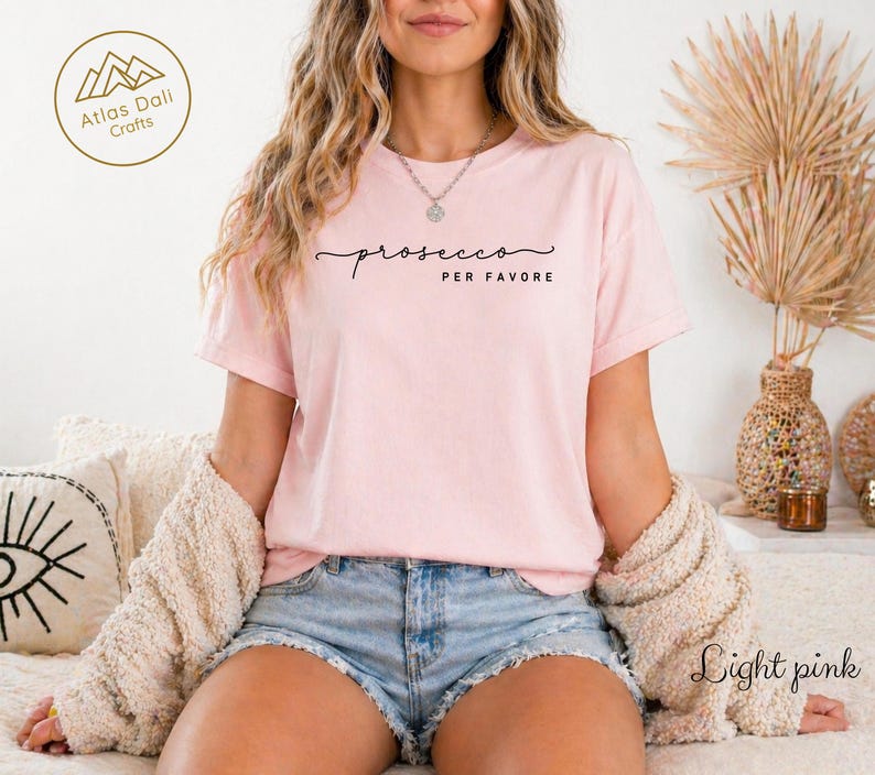 Celebrate your love for bubbly with our “prosecco please” minimalist tee – designed for the wine lover with a taste for elegance, sass, and simplicity. This clean, modern design features soft handwritten script paired with bold caps, making it perfect for brunches, wine tastings, vacations, or casual nights out with the girls.