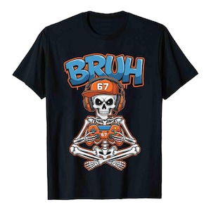 May include: Black t-shirt featuring a skeleton gamer with a headset and controller. The word "BRUH" is in blue and orange graffiti-style lettering above the skeleton. The skeleton is wearing an orange hat with the number 67.