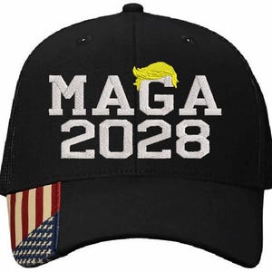 May include: Black mesh trucker hat with a white embroidered design that says "MAGA 2028". The hat has a red, white and blue American flag on the front.