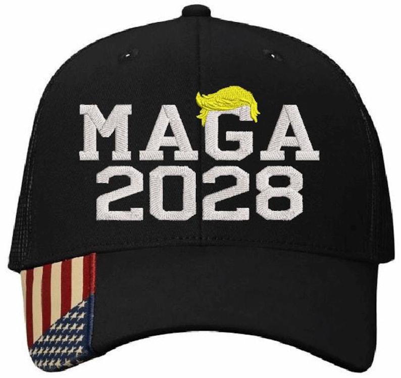 May include: Black mesh trucker hat with a white embroidered design that says "MAGA 2028". The hat has a red, white and blue American flag on the front.