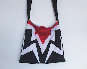 Upcycled sling bag with graphic print in red, black, and white, made from vintage fabrics