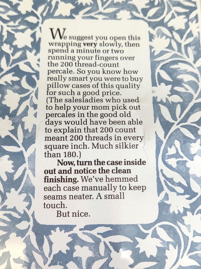 May include: Text on a white background with a blue floral pattern. The text reads, "We suggest you open this wrapping very slowly..." and continues to describe the product's quality and features.